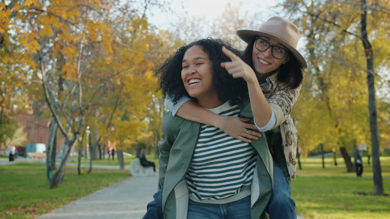 Two Friends Enjoying a Fall Day in the Park