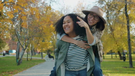 two friends enjoying a fall day in the park