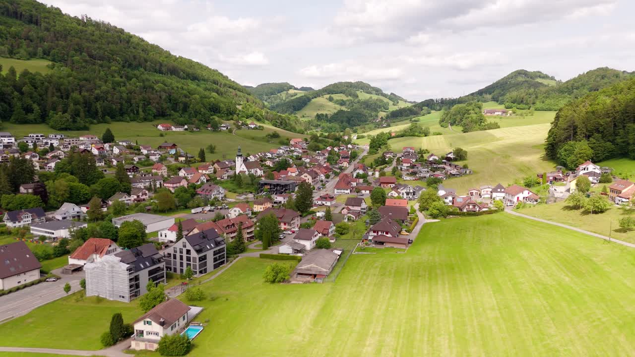 Charming aerial view of Holderbank, Solothurn in a lush green summer landscape