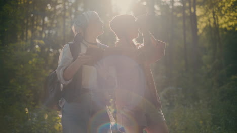 female hikers exploring forest during sunny day