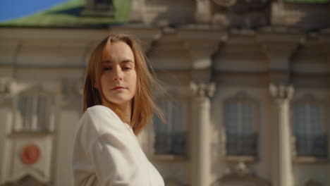 woman enjoying the sunshine in a city