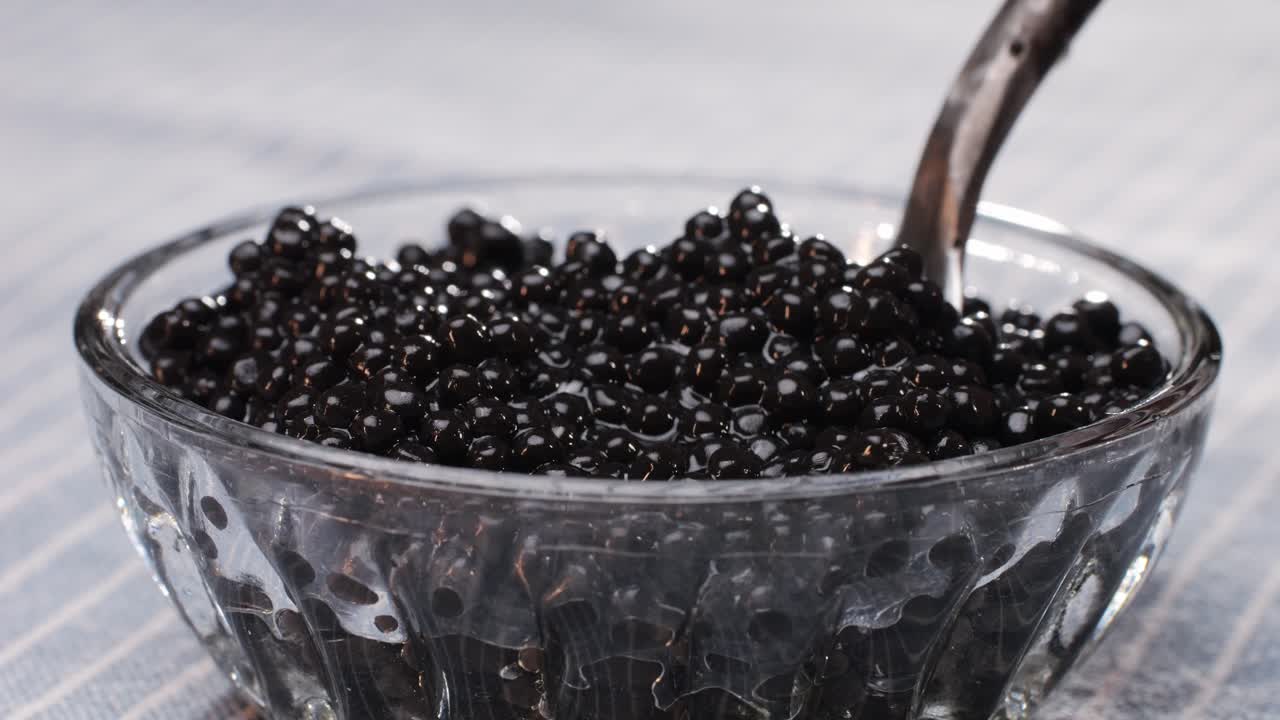 Delicious Black Caviar in a Glass Bowl