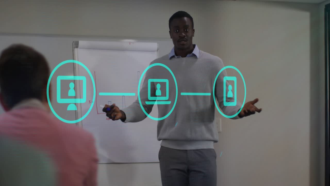 Tech presenter speaking beside chart and pointing causing PC laptop smartphone icons linking bars