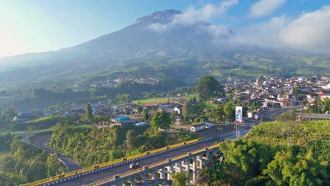 panoramic aerial view of the landscape with the sigandul bridge near mount sumbing, indonesia