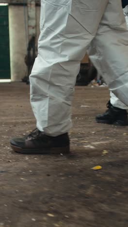 workers in protective suits