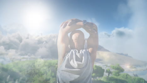 animation of glowing lights over senior man exercising and clouds background