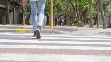 Man-walking-on-zebra-crossing-4k