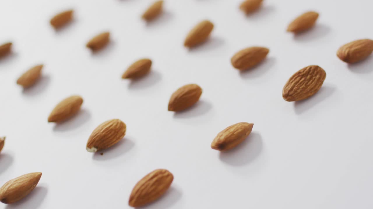 Video of almonds on white background