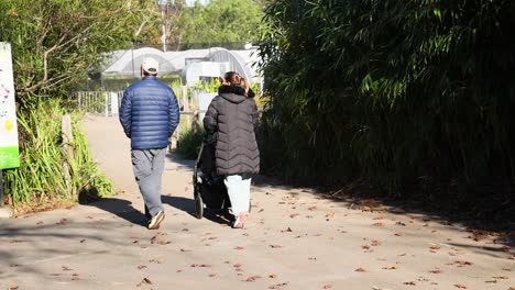 family walking with stroller in melbourne zoo