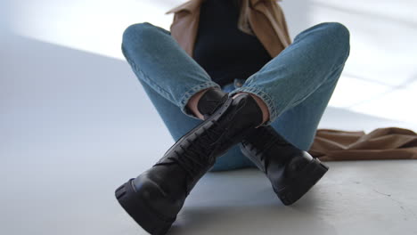 woman in jeans and black boots