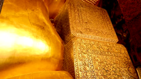 close-up views of a reclining buddha statue