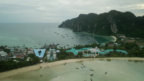 aerial view of tropical phi phi islands bay with boats and resorts