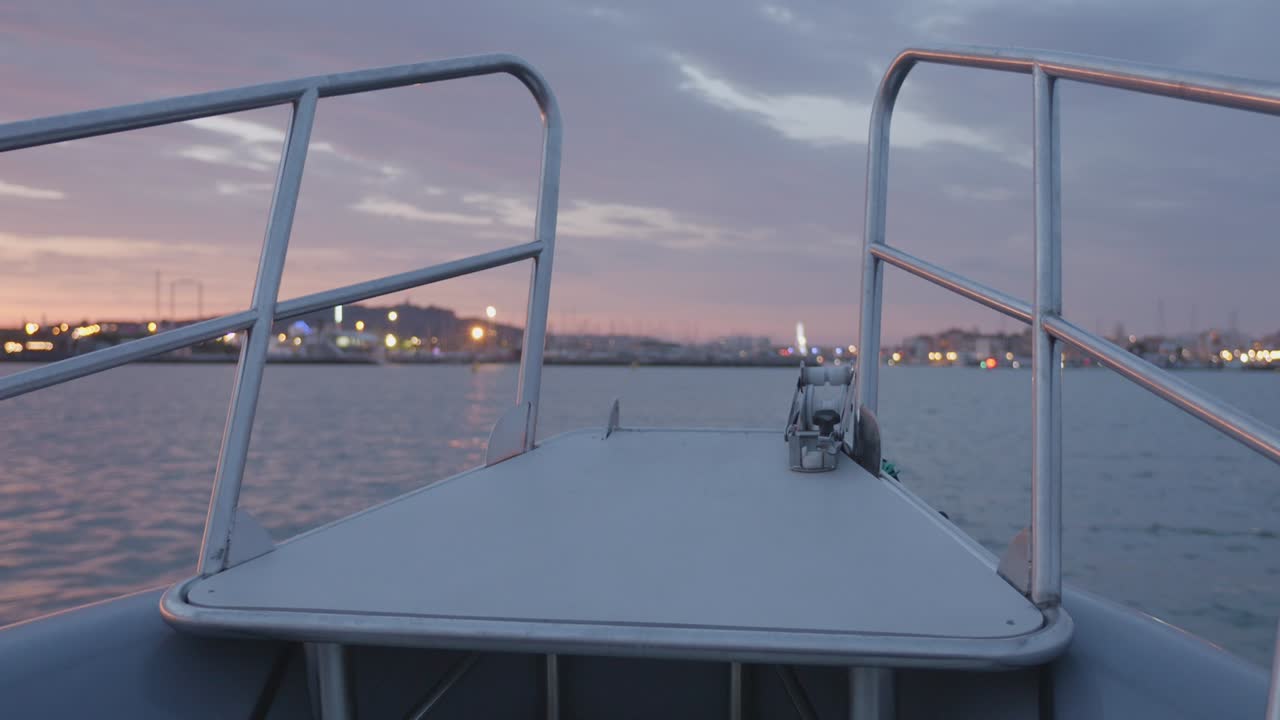 Point of view from a boat sailing in Cap d’Agde, France, during sunset with calm sea and warm light