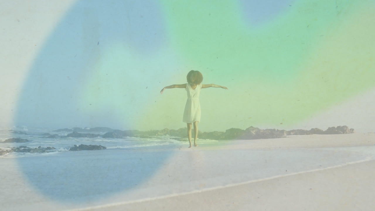 woman walking barefoot on sandy shore, featuring pastel light leaks for wellness marketing
