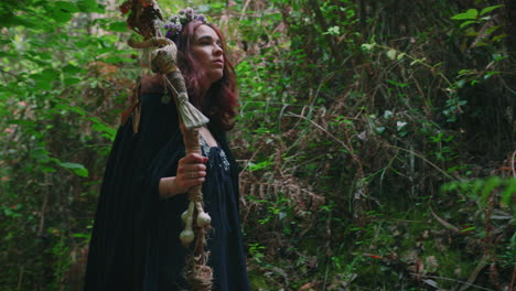 young druid girl walking in a forest medium shot