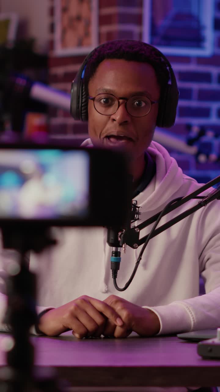 Podcast recording in studio with man wearing headphones
