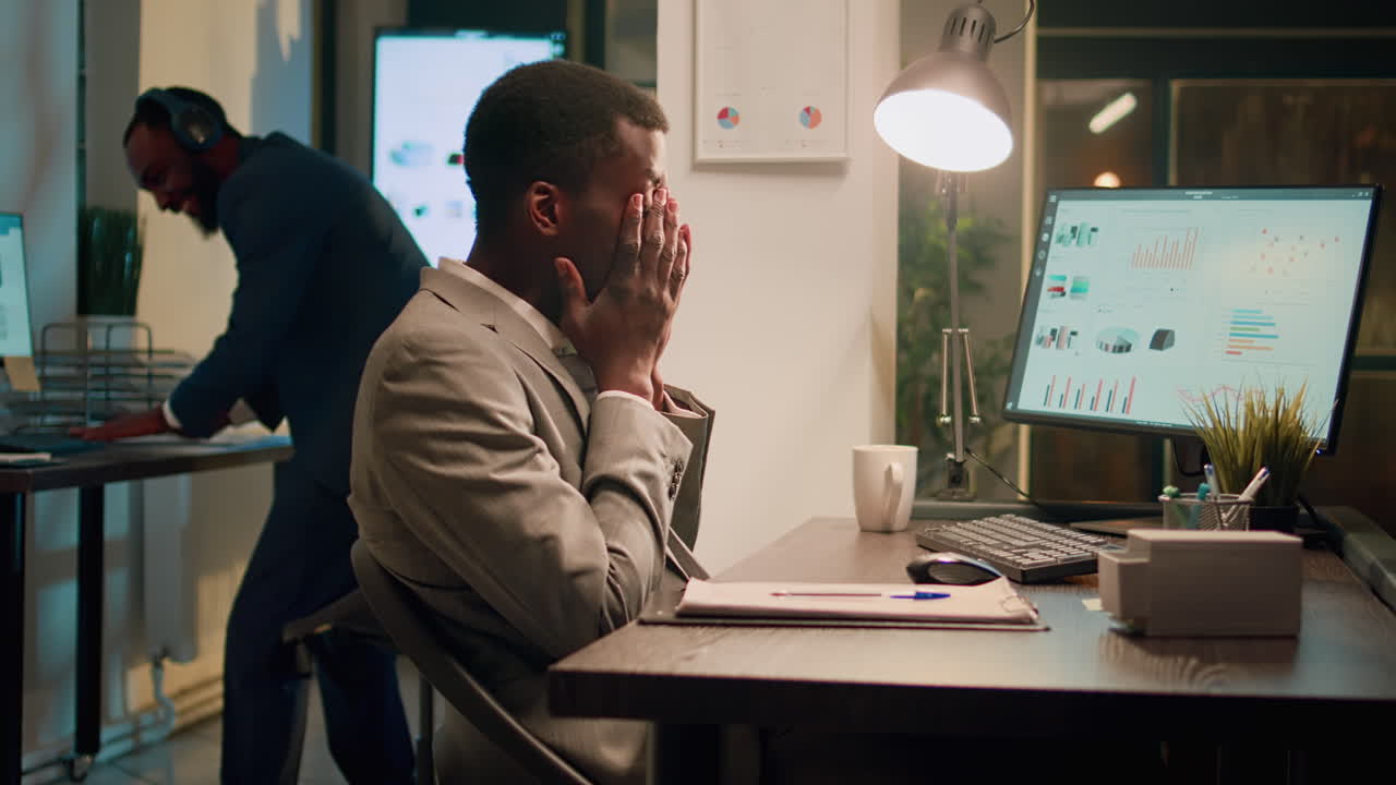 Businessmen Working Late in Office