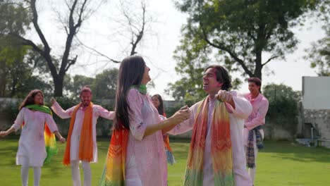 indian couple enjoying at a holi party