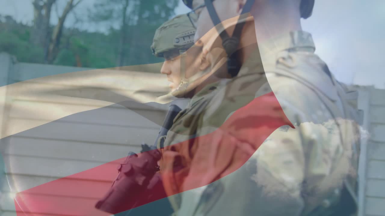 Two soldiers standing guard in military compound, flag overlay drifting across faces and rifles
