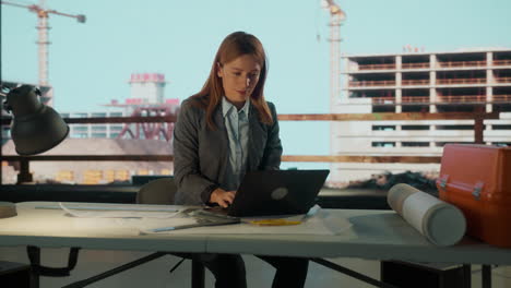 woman architect or engineer working on construction site