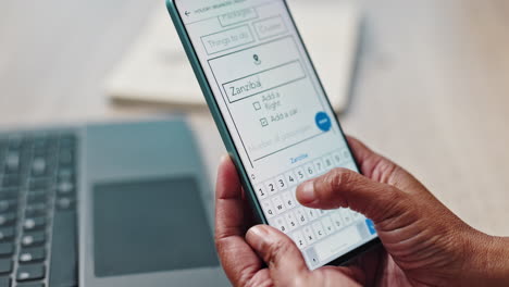 person using a mobile phone to plan a holiday