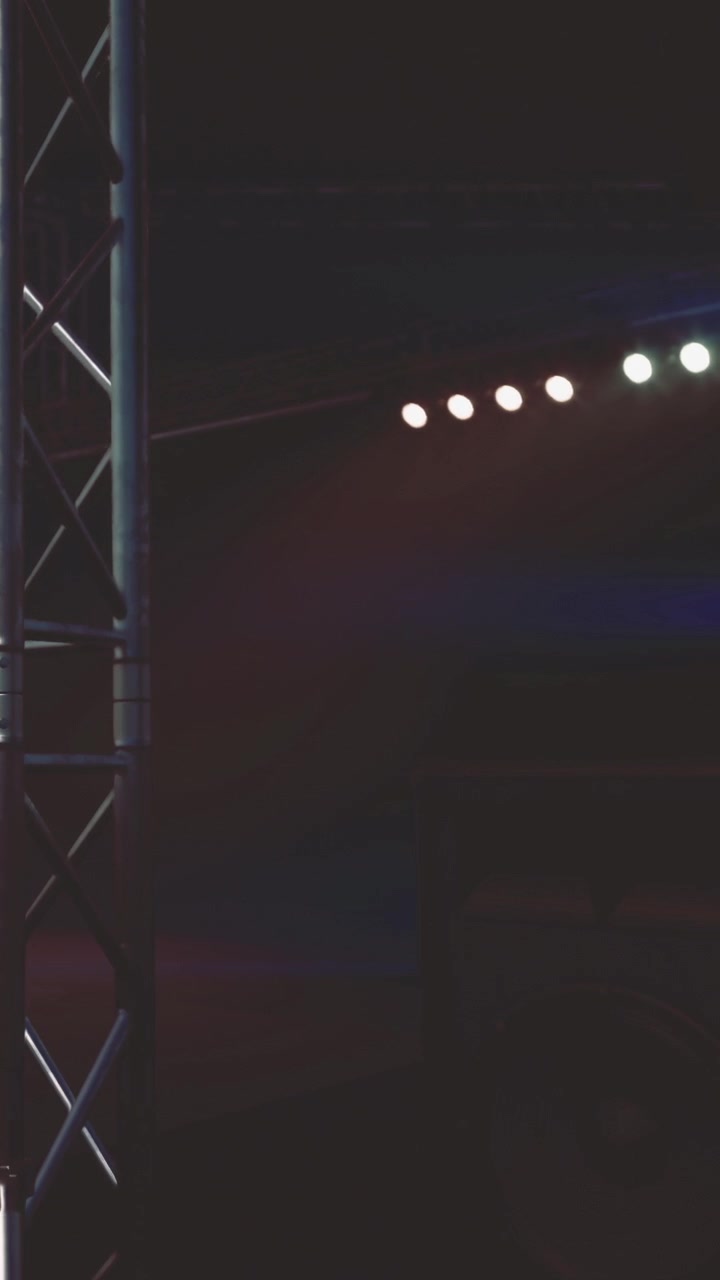 Lighting setup for performance on stage at night near audience area