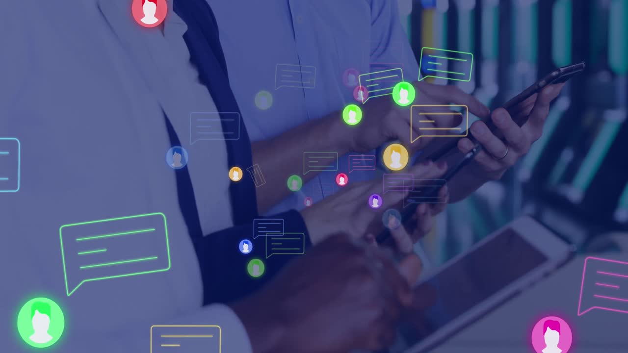 Animation of social media icons and data processing over business people using computers