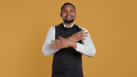 Portrait-professional-server-posing-with-confidence-with-arms-crossed-in-studio