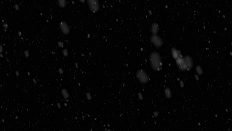 falling snow against black background for overlay. alpha