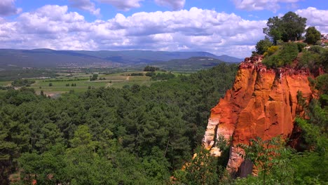 bright red cliffs near the town of roussillon in provence france