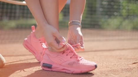 female tennis player practicing serve on outdoor court