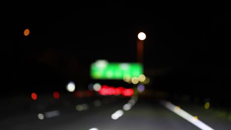 blurry images of a nighttime highway journey