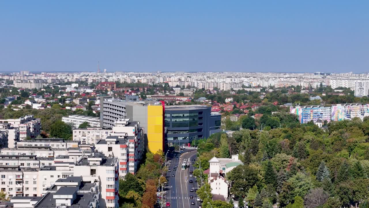 Aerial Shot of Oltenitei Street with Traffic and Bucharest's Skyline in the Background, Romania