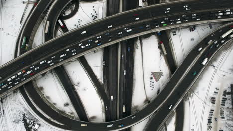 Drone-view-of-cars-driving-on-road-junction