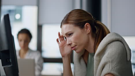 Worried-businesswoman-checking-computer-data-closeup.-Focused-it-specialist-work