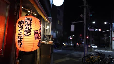 glowing lantern with city backdrop at night