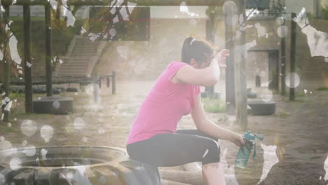 animation of leaves over caucasian woman at obstacle course resting