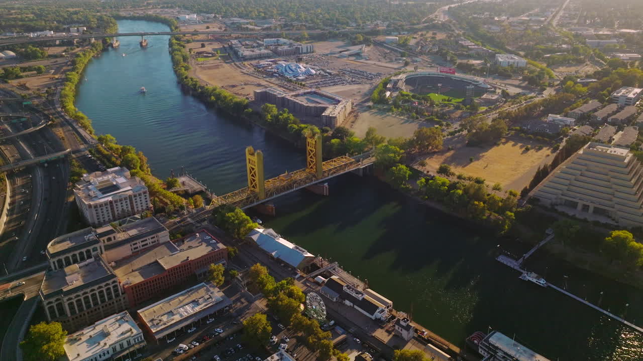 Beautiful view of Sacramento River with bridges over it. Drone descending over the lovely city on sunny day.