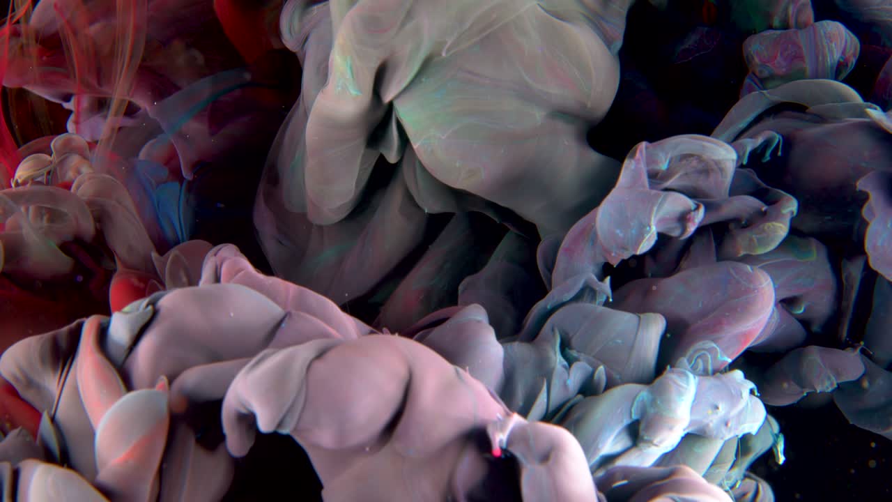 Rainbow Red, Blue, Yellow paint ink drop in water. Inky smoke cloud Abstract art