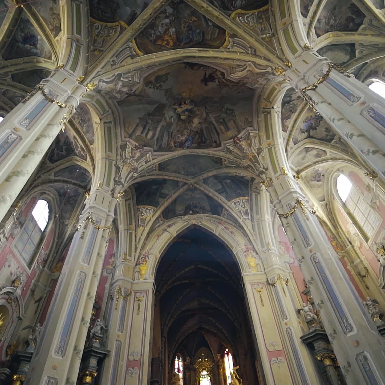 Interior of the beautiful cathedral with long columns. Cathedral of the Assumption of the Blessed Virgin Mary. Camera moves to the ceiling.