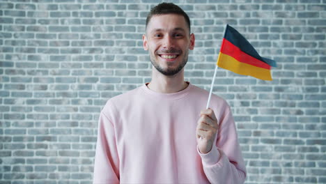 man holding german flag