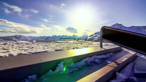 Winter-skate-park-covered-in-deep-layer-of-snow,-time-lapse-on-sunny-day