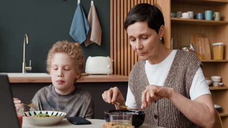 mother and son share a meal at home
