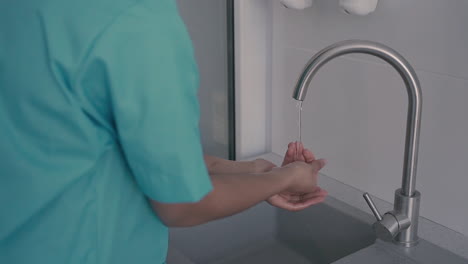 detail of hand washing by a healthcare professional