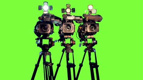 professional broadcast studio video cameras on green screen.