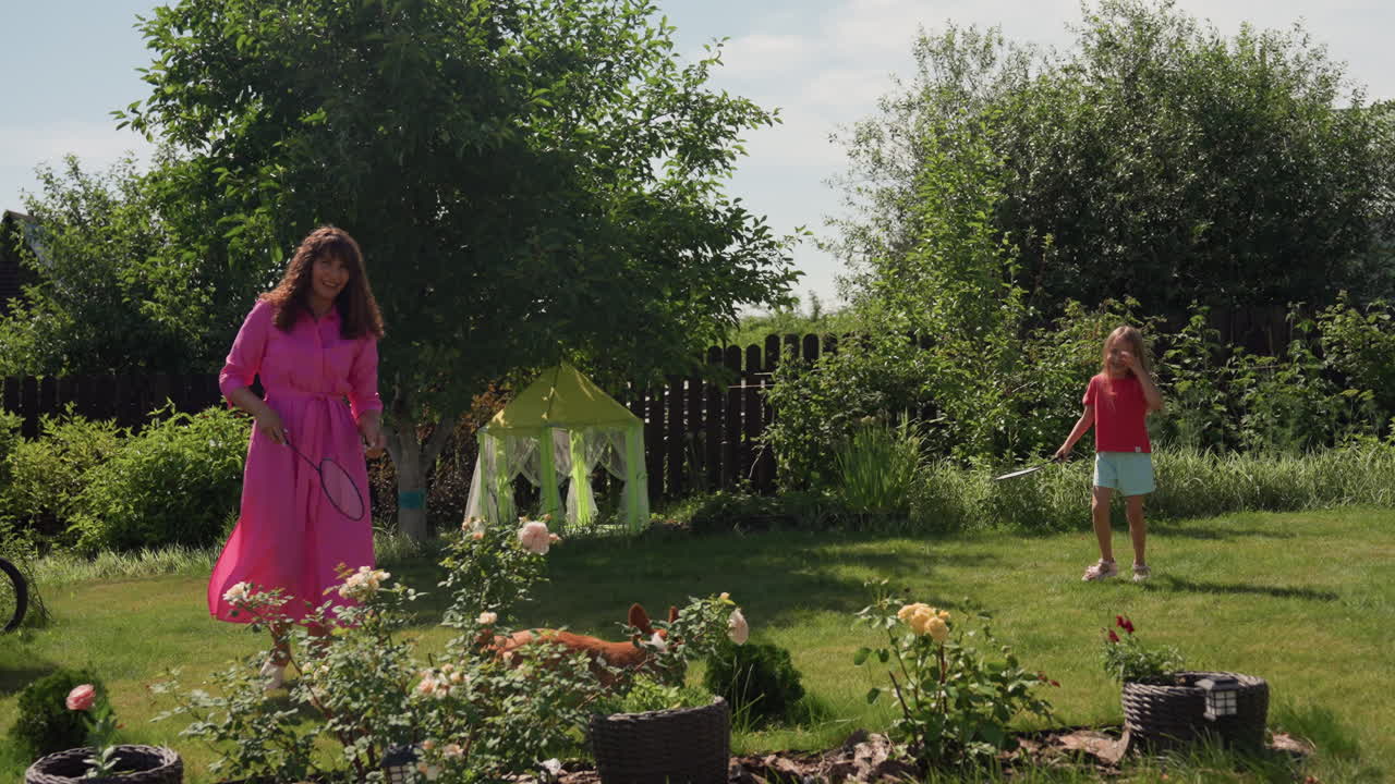 Children Playing Happily Outside In Summer, Mother And Child Partake In Energetic Outdoor Games, Cheerful Family Enjoying Summer Activities In Garden Under Bright Sunlight And Outdoor Fun