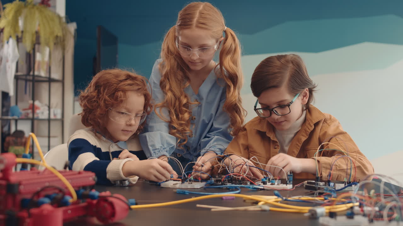 Children Engaged in Robotics and Electronics Project