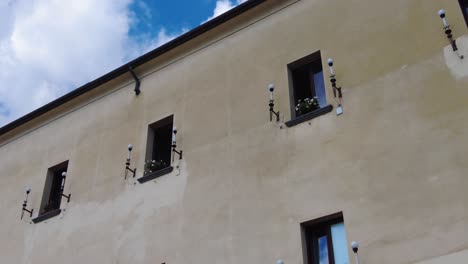 windows with lamps on the building on the side street of amalfi coast in italy