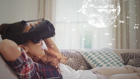 Woman-in-bedroom-wearing-virtual-reality-glasses