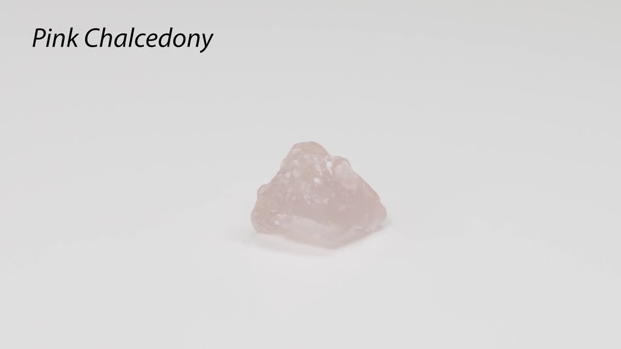Rotating pink chalcedony on a white background